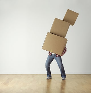 A person carrying three boxes