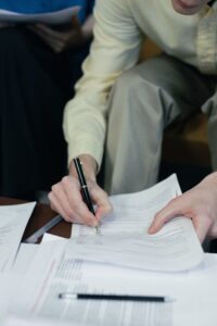 documentation. man writing on a paper